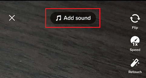 Tap on the Add sound option from the top of the camera screen