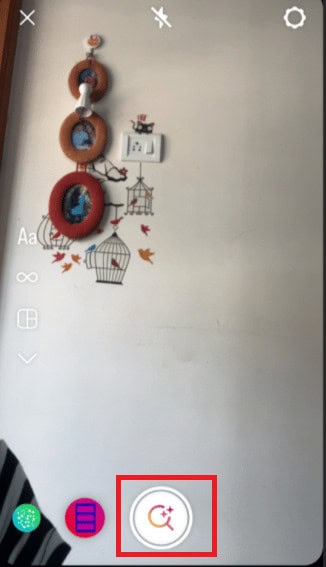 Next, go to your story and tap on the magnifying glass icon which appears after you slide all filters.
