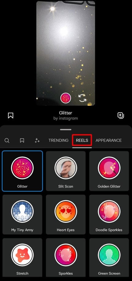 Tap the Reel button to browse popular reel filters. | How to Use Trending Popular Instagram Reel Effects